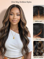A woman modeling a long body wave wig with highlighted brown and black tones by WigOutlets