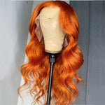 A long, wavy wig in a vivid ginger human hair from WigOutlets