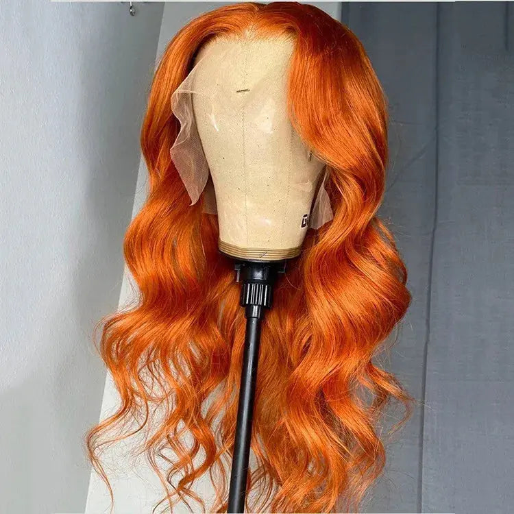 A long, wavy wig in a vivid ginger human hair from WigOutlets