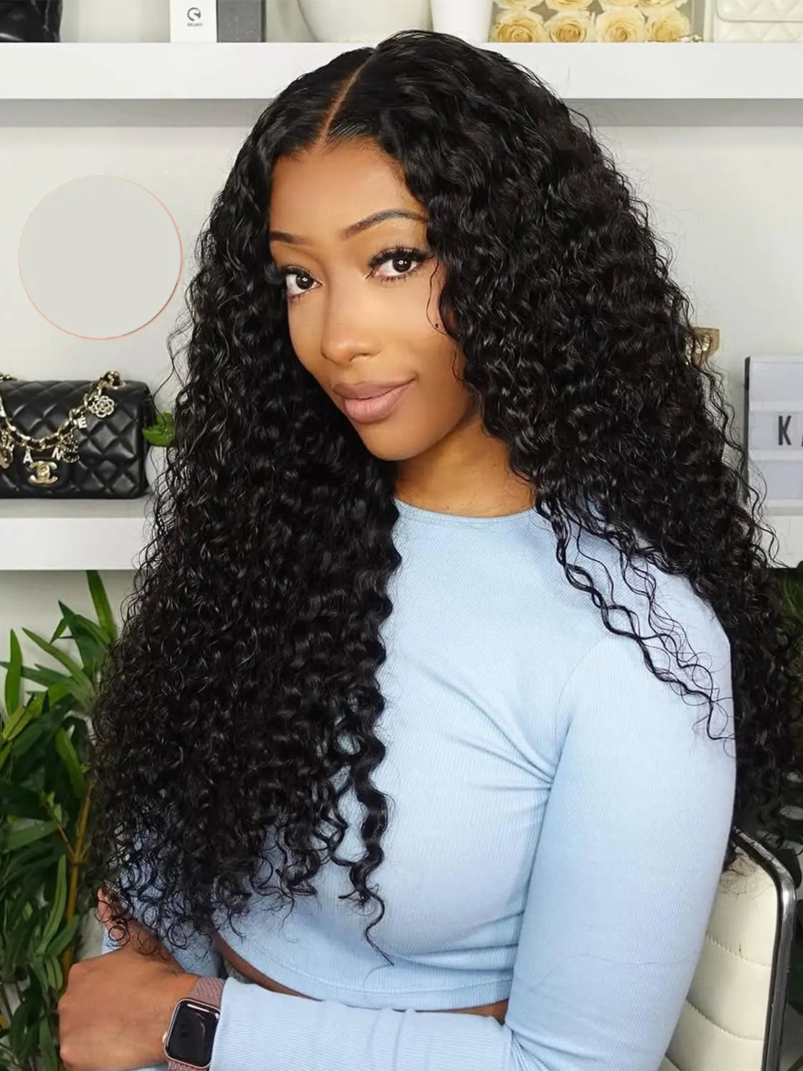 A woman with long, dark, curly human hair wig from WigOutlets
