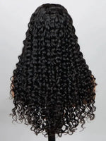 A long, full wig with tight, glossy black human hair curls from WigOutlets