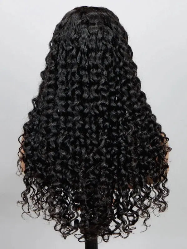 A long, full wig with tight, glossy black human hair curls from WigOutlets